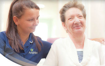 Lovely picture of a smiling person being supported by a member of care staff and the caption Always Ready to Help You